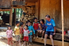 Tired Biker with Vietnamese Children