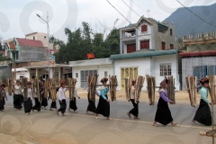 Women Walking with Wood