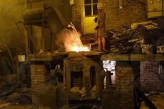 metal-worker-feeding-the-fire