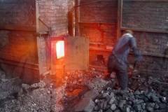 metal-worker-stoking-the-fire